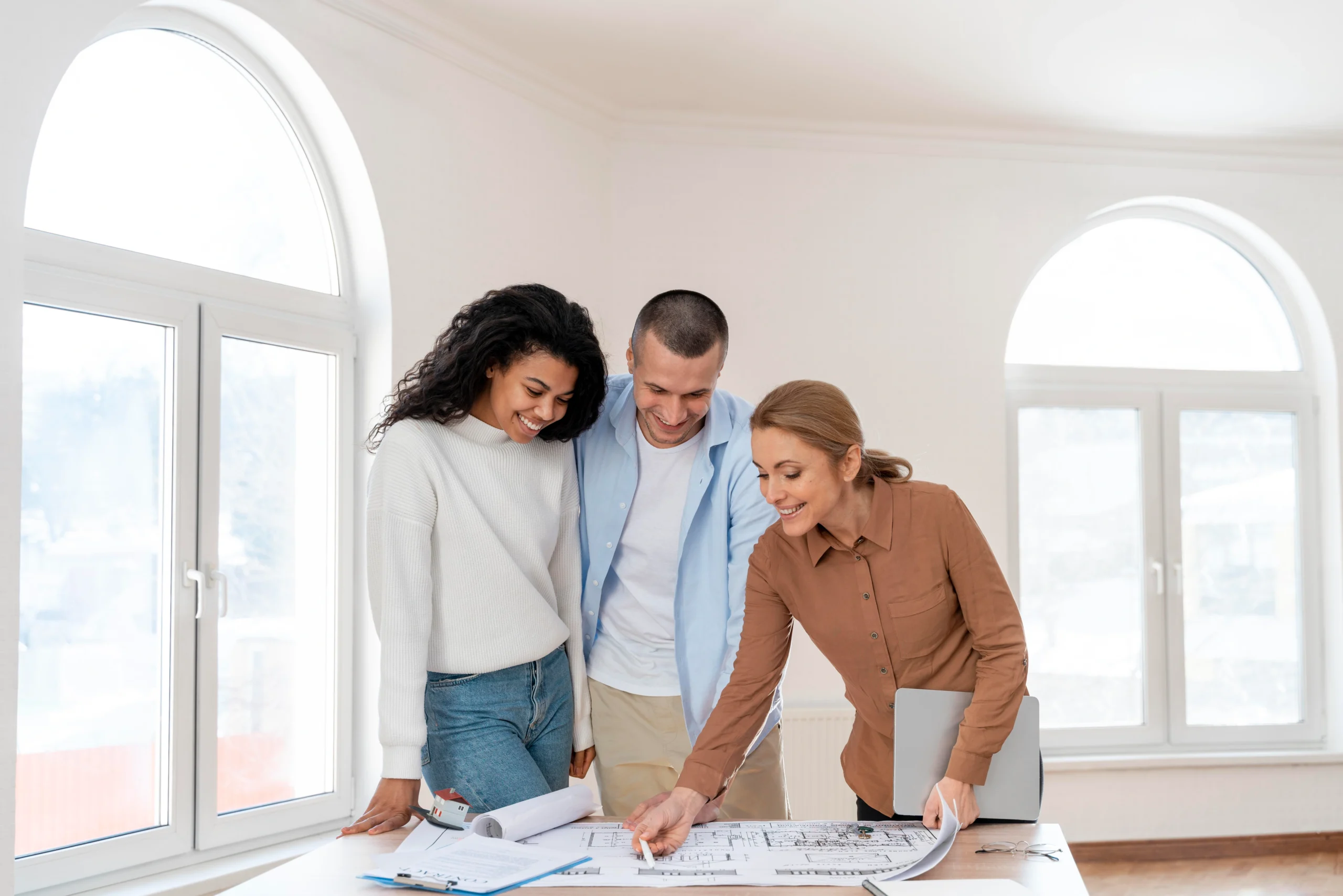 front-view-female-realtor-showing-new-house-plan-couple
